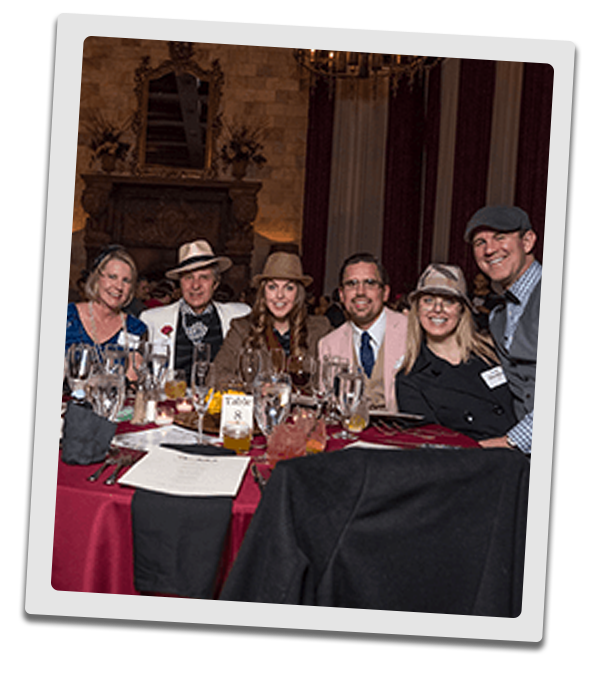 Detroit Murder Mystery party guests at the table