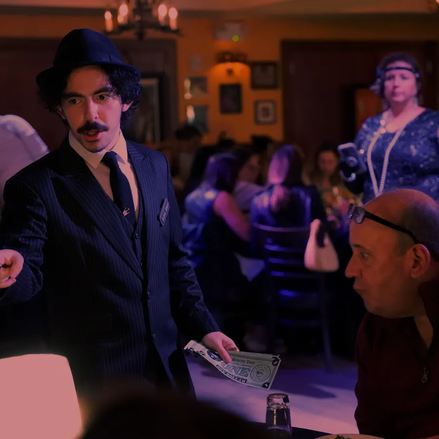 A Murder Mystery Company actor working the room at a Detroit show